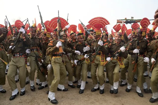 Indian Border Security Force (BSF) new recruits cheer during a passing out parade in Humhama on the outskirts of Srinagar on November 9, 2023. (Photo by Tauseef Mustafa/AFP Photo)