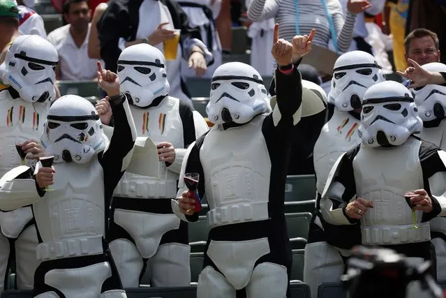 Rugby fans dress as Stormtroopers, the character from movie “Star Wars” during a second day match of the Hong Kong Sevens rugby tournament in Hong Kong, Saturday, March 28, 2015. (Photo by Kin Cheung/AP Photo)