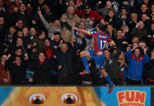 Crystal Palace's English striker Glenn Murray celebrates scoring their opening goal in front of the Palace supporters during the English Premier League football match between Crystal Palace and Manchester City at Selhurst Park in south London on April 6, 2015. (Photo by Glyn Kirk/AFP Photo)