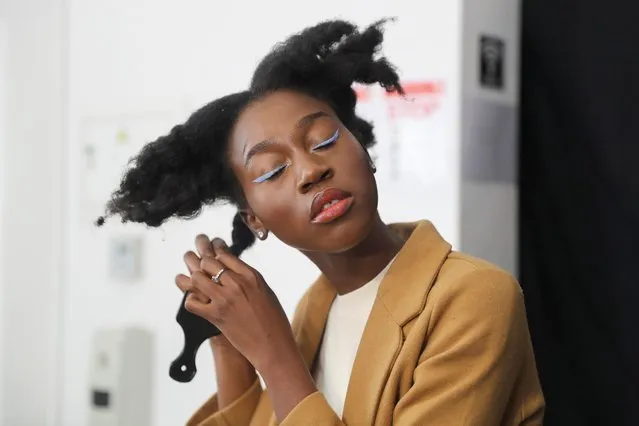 Lehlogonolo Machaba, the first openly transgender woman to compete for the Miss South Africa title combs her hair before a photo shoot in Johannesburg, South Africa, July 24, 2021. (Photo by Sumaya Hisham/Reuters)
