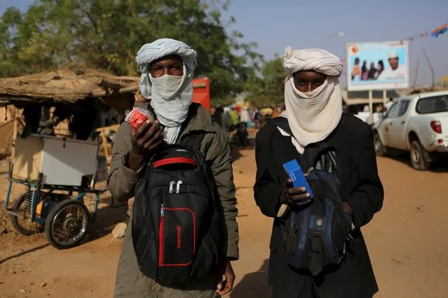 Two young Fulani men sell mobile phones in Niamey, Niger, February 19, 2016. (Photo by Joe Penney/Reuters)