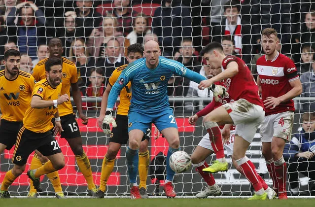 Wolverhampton goalkeeper John Ruddy, center, eyes the ball during the English FA Cup fifth round soccer match between Bristol City and Wolverhampton Wanderers at Ashton Gate stadium in Bristol, England, Sunday, February 17, 2019. (Photo by Frank Augstein/AP Photo)