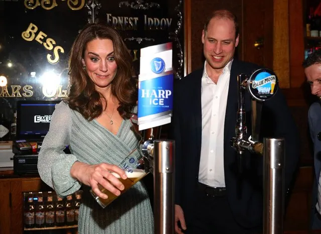 The Duchess of Cambridge pulls a pint with the Duke of Cambridge during their visit to Belfast Empire Hall for an informal party to celebrate inspirational young people who are making a real difference in Northern Ireland as part of their two day visit to Northern Ireland on February 27, 2019. (Photo by Aaron Chown/PA Wire Press Association)