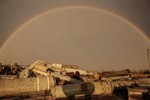 A rainbow above the debris of spent missiles in the village of Posad-Pokrovske in the Kherson region, 01 November 2023. Russia bombarded 118 Ukrainian towns and villages in 24 hours, more than on any other day this year, Ukrainian Interior Minister Ihor Klymenko announced 02 November 2023. Russian troops entered Ukrainian territory in February 2022, starting a conflict that has provoked destruction and a humanitarian crisis. (Photo by Oleg Petrasyuk/EPA/EFE)