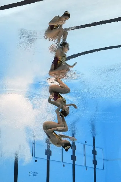 Hilda Tri Julyandra and Gabrille Permata Sari of Indonesia competes in the women's duet technical of artistic swimming at the World Aquatics Championships in Doha, Qatar, Friday, February 2, 2024. (Photo by Lee Jin-man/AP Photo)