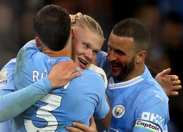 Manchester City's Norwegian striker #09 Erling Haaland (C) celebrates with teammates after scoring his team first goal during the English Premier League football match between Manchester City and Brentford at the Etihad Stadium in Manchester, north west England, on February 20, 2024. (Photo by Lee Smith/Action Images via Reuters)