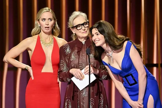 From left, actresses Emily Blunt, Meryl Streep and Anne Hathaway speak on stage at the Screen Actors Guild Awards in Los Angeles on Sunday, February 24, 2024. They paid homage to their characters from “The Devil Wears Prada” as they presented an award. (Photo by Michael Buckner/Variety/Getty Images)