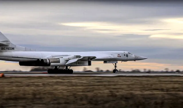 In this photo taken from video released by Russian Defense Ministry Press Service, a long-range Tu-160 bomber of the Russian Aerospace Forces lands after patrolling in the airspace of Belarus at an air field in Russia, Thursday, November 11, 2021. Russia has sent two nuclear-capable strategic bombers on a training mission over Belarus in a show of Moscow's support for its ally amid a dispute over migration at the Polish border. Russia has supported Belarus amid a tense standoff this week as thousands of migrants gathered on the Belarus-Poland border in hopes of crossing into Europe. (Photo by Russian Defense Ministry Press Service via AP Photo)