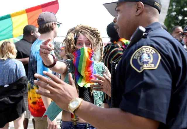 Counter-protesters are blocked by law enforcement as members of the National Socialist Movement, a white nationalist group, demonstrate against the LGBTQ event Motor City Pride in Detroit, Michigan, U.S., June 8, 2019. (Photo by Jim Urquhart/Reuters)