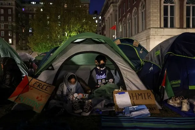 Students prepare to camp overnight as they continue to protest on Columbia University campus in support of Palestinians, during the ongoing conflict between Israel and the Palestinian Islamist group Hamas, in New York City, April 23, 2024. (Photo by Caitlin Ochs/Reuters)
