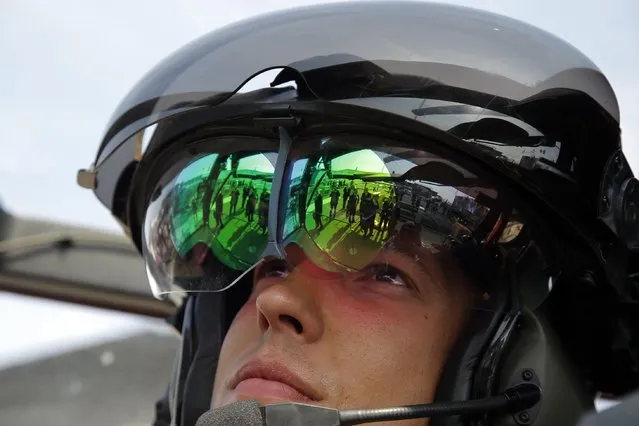 French Lieutenant Romain of the 1st Regiment of Combat Helicopter based in Falsbourg, eastern France, stands in a Tigre HAD Helicopter during the Paris Air Show, at Le Bourget airport, north of Paris, Tuesday, June 16, 2015. Some 300,000 aviation professionals and spectators are expected at this weekends Paris Air Show, coming from around the world to make business deals and see dramatic aeronautic displays. (AP Photo/Francois Mori)