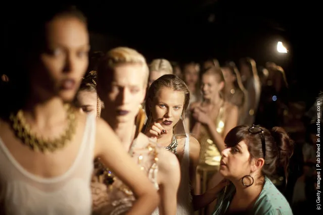 Models prepare backstage before a fashion show by Israeli designer Yossef during the Tel Aviv Fashion Week