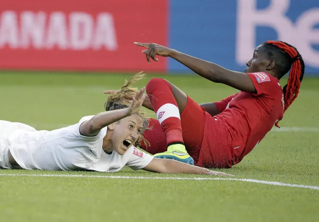 New Zealand midfielder Annalie Longo (16) reacts after she is brought down by Canada defender Kadeisha Buchanan (3) in Edmonton, June 11, 2015. (Photo by Erich Schlegel/USA TODAY Sports)