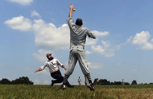 Lawrence Major, 29, of Somerville, N.J., from the Liberty Base Ball Club of New Brunswick slides safely into home as Steve “Lefty” Scharff, 37, of Williamstown, N.J., from the Lewes Base Ball Club fields the ball during the National 19th Century Base Ball Festival in Gettysburg, Pa. on July 21, 2019. (Photo by Matt McClain/The Washington Post)