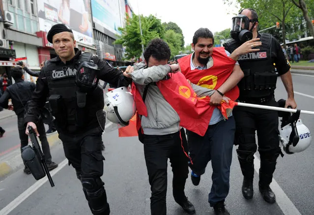 Turkish riot police detain a protester as he and others attempted to defy a ban and march on Taksim Square to celebrate May Day, in Besiktas neighbourhood of Istanbul, Turkey, May 1, 2016. (Photo by Yagiz Karahan/Reuters)
