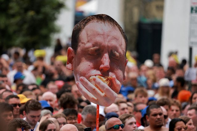 A banner displaying World Champion Joey Chestnut is seen on the day of 2023 Nathan's Famous Fourth of July International Hot Dog Eating Contest at Coney Island in New York City, U.S., July 4, 2023. (Photo by Amr Alfiky/Reuters)