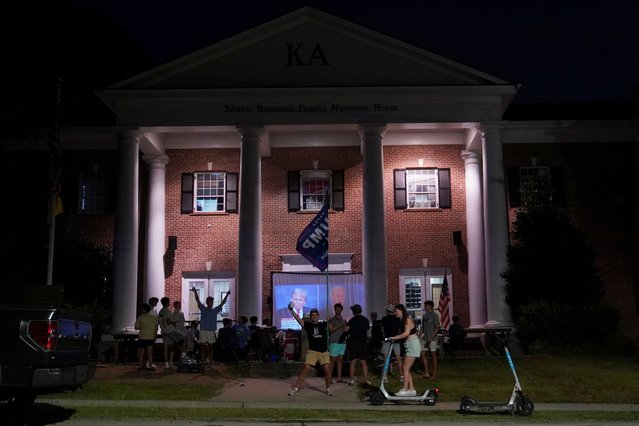 Students watch the first 2024 presidential debate outside their fraternity house in Atlanta, Georgia on June 27, 2024. (Photo by Megan Varner/Reuters)