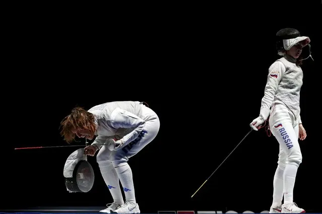 Italy's Arianna Errigo (L) celebrates the victory over team Russia, beside Russia's Larisa Korobeynikova, in their women's team foil final at the World Fencing Championships in Moscow, Russia, July 19, 2015. (Photo by Grigory Dukor/Reuters)