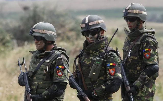 Romanian soldiers march during a joint military exercise with NATO members, called “Agile Spirit 2015” at the Vaziani military base outside Tbilisi, Georgia, July 21, 2015. (Photo by David Mdzinarishvili/Reuters)
