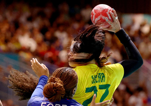 Tamara Horacek of France, Marcela Arounian of Brazil, Pauletta Foppa of France and Samara Vieira of Brazil in action during the women's handball preliminary group round on July 30, 2024. (Photo by Bernadett Szabo/Reuters)