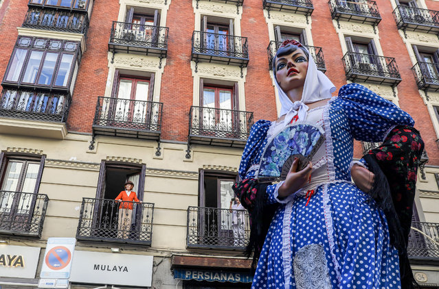 A big head, a typical character from Madrid, tours the streets of the old town center before the proclamation from the Casa de la Villa in Madrid on May 10, 2023. The Madrid City Council has kicked off the patron saint festivities of San Isidro 2023 with the traditional proclamation from the main balcony of La Casa de la Villa in Madrid in Plaza de la Villa. Before the proclamations, people were able to enjoy a parade of giants and big heads. The person in charge this year of giving the proclamation has been Ramoncín, a singer born in the city. (Photo by David Canales/SOPA Images/Rex Features/Shutterstock)