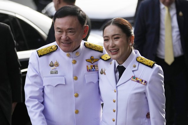 Thailand's former Prime Minister Thaksin Shinawatra, left, and his daughter and newly elected Prime Minister Paetongtarn Shinawatra arrive before the royal endorsement ceremony appointing Paetongtarn as Thailand's new prime minister at Pheu Thai party headquarters in Bangkok, Thailand, Sunday, August 18, 2024.  (Photo by Sakchai Lalit/AP Photo).