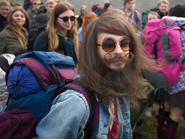 Bryan Patterson, 28, from Liverpool poses for a photograph as he queues to get into Worthy Farm in Pilton for the first day of the 2014 Glastonbury Festival on June 25, 2014 in Glastonbury, England. Gates opened today at the Somerset dairy farm that plays host to one of the largest music festivals in the world. (Photo by Matt Cardy/Getty Images)