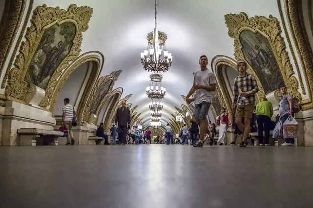 People walk at Kievskaya subway (Metro) station in Moscow, Russia, Tuesday, June 20, 2017. The Moscow subway hopes to provide an easy, safe and cheap way to travel around Moscow during the Confederations Cup or next year's World Cup. (Photo by Alexander Zemlianichenko/AP Photo)