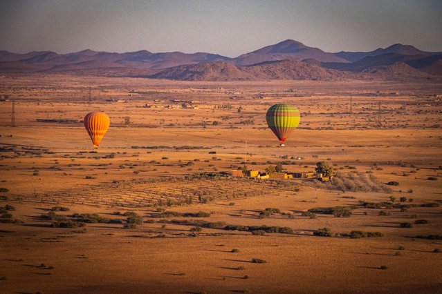 Flight with hot air balloon over Marrakech at sunrise, aerial view of desert and High Atlas Mountains on March 27, 2024. (Photo by Andrea Aigner/Getty Images)