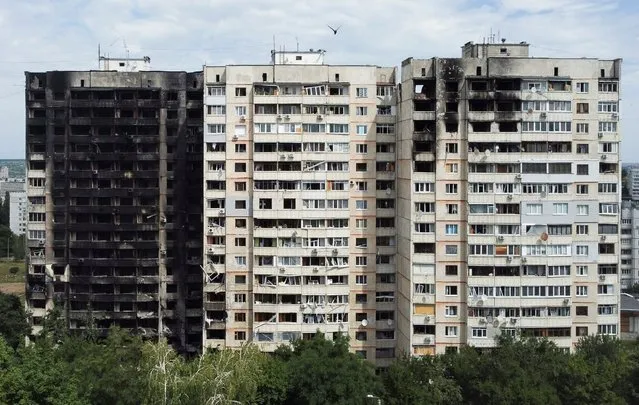 Buildings destroyed by military strikes are seen, as Russia's invasion of Ukraine continues, in northern Saltivka, one of the most damaged residential areas of Kharkiv, Ukraine July 17, 2022. (Photo by Nacho Doce/Reuters)