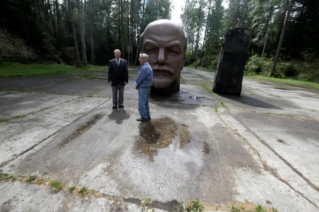 Former Soviet Army officers Leonid Konovalov (L) and Vladimir Procenko stand near the abandoned Soviet R12 nuclear missile launch site in Zeltini, Latvia, July 22, 2016. (Photo by Ints Kalnins/Reuters)