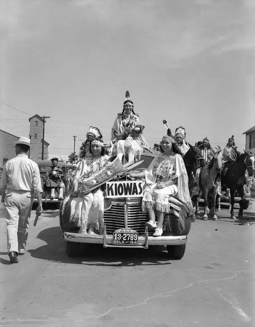 Left to right: Juanita Daugomah Ahtone (Kiowa), Evalou Ware Russell (center), Kiowa Tribal Princess, and Augustine Campbell Barsh (Kiowa) in the American Indian Exposition parade. Anadarko, Oklahoma, 1941. (Photo and caption by 2014 Estate of Horace Poolaw)