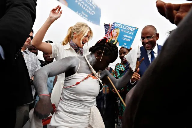 White House senior adviser Ivanka Trump dances with traditional dancers as she is welcomed by local people on arrival to Adzope, Ivory Coast, Wednesday April 17, 2019, where she will tour Cayat, a cocoa and coffee cooperative. At far right is Minister Patrick Achi. Trump is visiting Ethiopia and Ivory Coast to promote a White House global economic program for women. (Photo by Jacquelyn Martin/AP Photo)