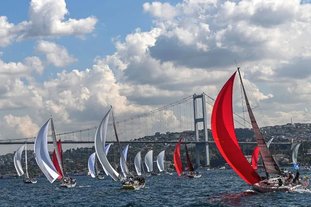 Sailors participate in the 21st Bosphorus Cup sailing race in Istanbul, on September 24, 2022. (Photo by Ozan Kose/AFP Photo)