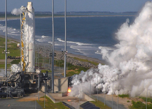 This Tuesday May 31, 2016 image from video provided by NASA shows an Orbital ATK full-power test of the upgraded Antares medium-class rocket using new RD-181 engines at the at Virginia Space's Mid-Atlantic Regional Spaceport at NASA Wallops Island Test Flight Facility in Wallops Island, Va. Orbital ATK, one of NASA's prime shippers, was supposed to return its Antares rocket to flight in August 2016 after a nearly two-year grounding. But on Wednesday, August 10, 2016, the company delayed liftoff of the retooled, unmanned rocket until mid-September. (Photo by NASA via AP Photo)