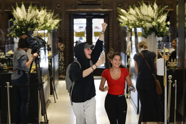 Customers cheer as they are allowed in the Selfridges department store in London, Monday, June 15, 2020. Whether its German holidaymakers basking in Spain's sunshine or Parisians renewing their love affair with their city, Monday's border openings and further scrapping of restrictions offered Europeans a taste of pre-coronavirus life that they may have taken for granted. (Photo by Matt Dunham/AP Photo)