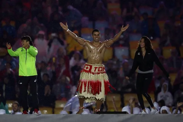 Pita Taufatofua of Tonga jumps on stage during the closing ceremony, August 21, 2016. (Photo by Ezra Shaw/Getty Images)