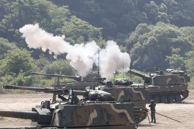 A South Korean army K-9 self-propelled howitzer fires during the annual exercise in Paju, South Korea, near the border with North Korea, Tuesday, June 23, 2020. A South Korean activist said Tuesday hundreds of thousands of leaflets had been launched by balloon across the border with North Korea overnight, after the North repeatedly warned it would retaliate against such actions. (Photo by Ahn Young-joon/AP Photo)