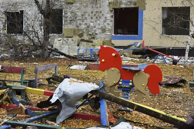 A destroyed school yard after Russian shelling is seen in Pokrovsk, Donetsk region, Ukraine, Friday, November 4, 2022. (Photo by Andriy Andriyenko/AP Photo)