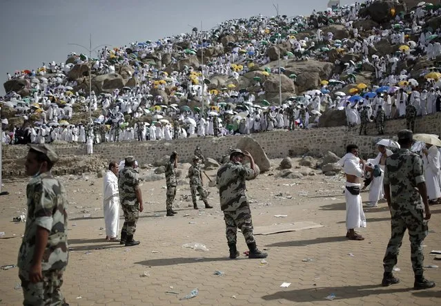 Saudi police keep watch at Mount Mercy on the plains of Arafat during the annual haj pilgrimage, outside the holy city of Mecca September 23, 2015. (Photo by Ahmad Masood/Reuters)
