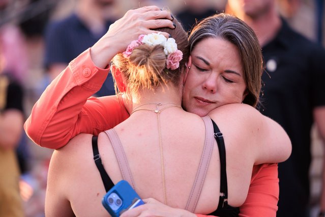 U.S. Rep. Angie Craig, D-Minn., embraces a woman while attending a candlelight vigil for Minnesota state Rep. Melissa Hortman and her husband Mark at the State Capitol, Wednesday, June 18, 2025, in St. Paul, Minn. (Photo by Nikolas Liepins/AP Photo)