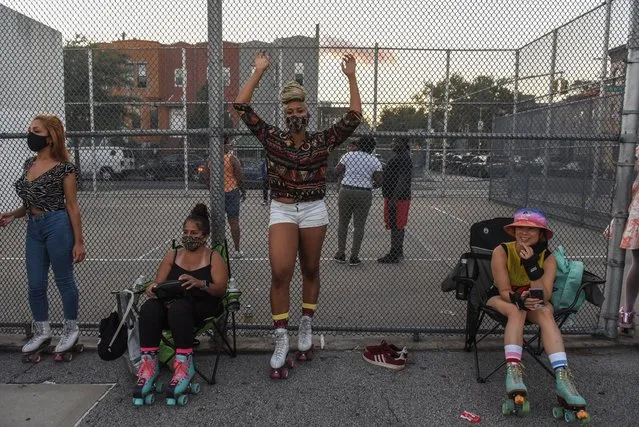A person poses for a portrait before participating in a “pop-up” roller skating session hosted by the Butter Roll skating club on September 5, 2020 in the Brooklyn borough of New York City. Outdoor roller skating has gained in popularity since restrictions on indoor activities were restricted due to the coronavirus (COVID-19) pandemic. (Photo by Stephanie Keith/Getty Images)