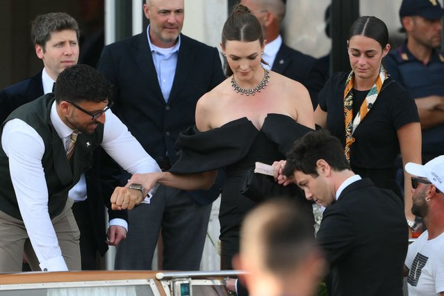 US tech entrepreneur Sam Altman (L) and US model Karlie Kloss leave the St Regis Hotel on the wedding day of Amazon founder Jeff Bezos with Lauren Sanchez, in Venice on June 27, 2025. (Photo by Marco Bertorello/AFP Photo)