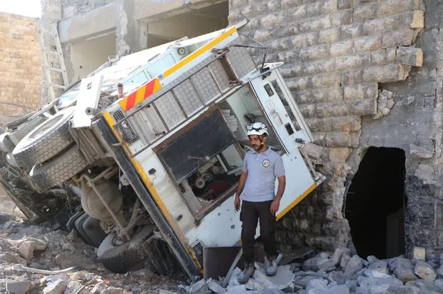 Debris of buildings and destroyed vehicles are seen after Russian warplanes hit the civil defence center at Al-Ansari town of Aleppo, Syria on September 23, 2016. (Photo by Ibrahim Ebu Leys/Anadolu Agency/Getty Images)