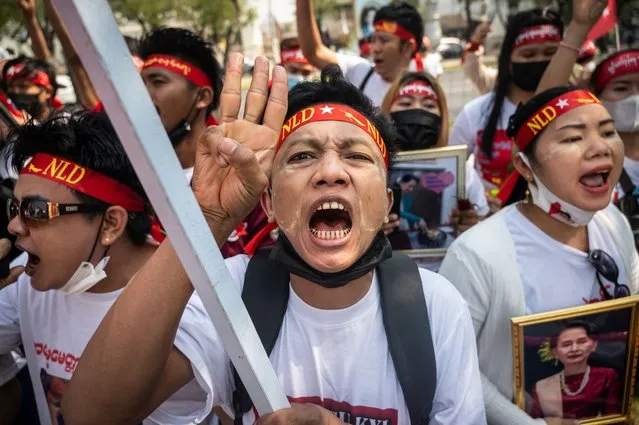 Activists shout while attending the anti Myanmar Junta demonstration in front of the United Nations building on February 01, 2023 in Bangkok, Thailand. For the 2nd Anniversary of coup d'état, thousand of activists join the demonstration at the Myanmar embassy and the United Nations building in Bangkok. (Photo by Sirachai Arunrugstichai/Getty Images)