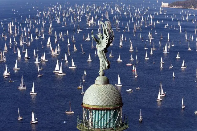 Sailing boats gather at the start of the Barcolana regatta in front of Trieste harbour, Italy, October 9, 2016. (Photo by Stefano Rellandini/Reuters)