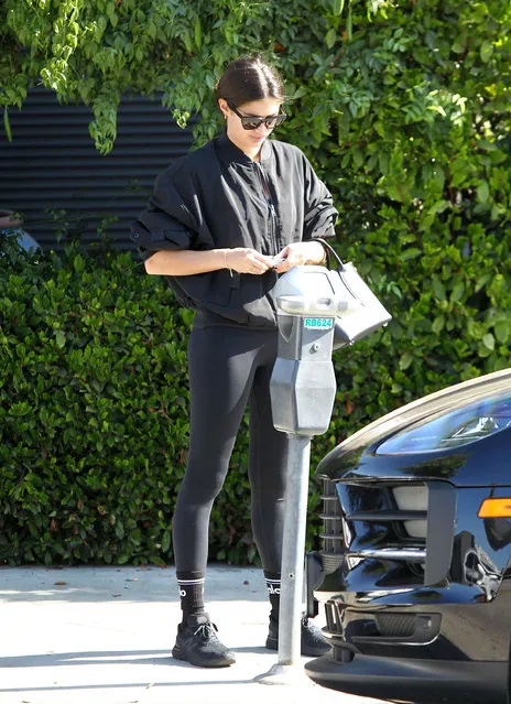 Portuguese model and actress Sara Sampaio seen dressed in all black and paying a parking meter in Los Angeles, USA on November 18, 2020. (Photo by Rex Features/Shutterstock)