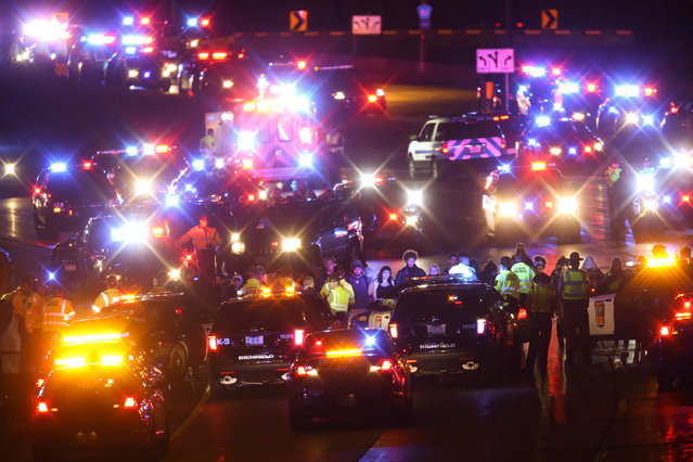 Demonstrators block a portion of Interstate 94, Monday, November 16, 2015, in Minneapolis. The mayor of Minneapolis on Monday asked for a federal civil rights investigation into the weekend shooting of a black man by a police officer during an apparent struggle. Community members and activists called for a federal investigation, as well as for authorities to release video of the incident and the officer's identity. (Photo by Jeff Wheeler/Star Tribune via AP Photo)