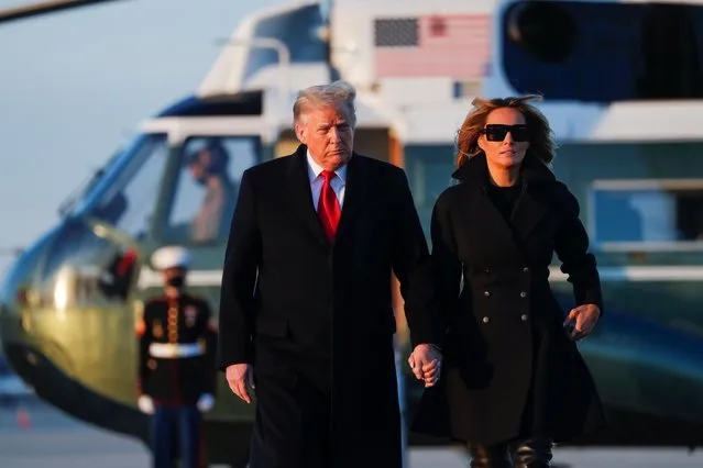 U.S. President Donald Trump and first lady Melania Trump prepare to board Air Force One at Joint Base Andrews in Maryland, U.S., December 23, 2020. (Photo by Tom Brenner/Reuters)
