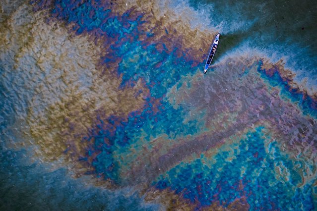 This aerial photo, taken on Monday, July 29, 2024 shows an oil slick from the MT Terra Nova, which capsized in the waters of Manila Bay near the coastal village of Santa Cruz, Philippines. The oil tanker capsized during strong winds and high waves caused by Typhoon Gaemi, Philippine authorities said. (Photo by Ezra Acayan/Getty Images)